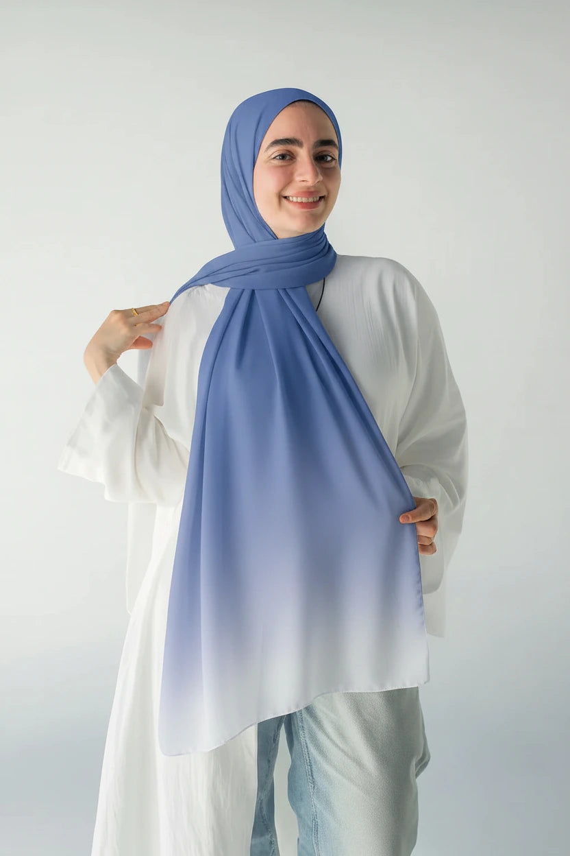 Model wearing the Sky Topaz blue ombré luxury chiffon hijab by JAIDA, styled with a white linen blouse